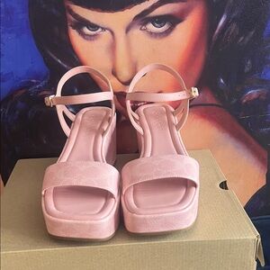 Coach Pink Platform Sandals
New with box never worn